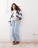 Reclaimed Vintage slouchy tie front cardigan in navy stripe