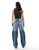 Bershka Petite slouchy baggy jeans in indigo wash