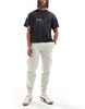 Bershka cuffed cargo pants in beige