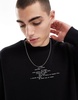 Bershka sweatshirt with feather graphic in black
