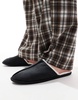 ASOS DESIGN mule slippers in black with faux shearling lining