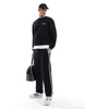 ASOS DESIGN straight leg sweatpants with textured side stripes in black