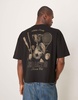 ASOS DESIGN boxy oversized T-shirt with back sports graphic in black