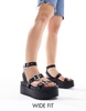 ASOS DESIGN Wide Fit Trombone chunky buckle detail flatforms in black