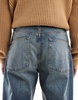ASOS DESIGN baggy jeans in mid wash with abrasions