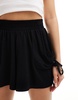 ASOS DESIGN shirred waist pocket shorts in black