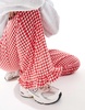 ASOS DESIGN gingham pants with frill hem in red
