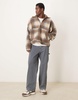 ASOS DESIGN extreme oversized boxy sweater with funnel neck in brown plaid