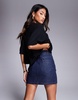 ASOS DESIGN denim mini skirt with glitter in blue