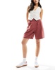 ASOS DESIGN tailored longline shorts in rust