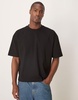 ASOS DESIGN boxy oversized T-shirt with back sports graphic in black