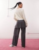 Reclaimed Vintage mini skirt over pants in gray