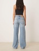 ASOS DESIGN baggy jean with rips in mid blue