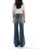 Bershka flared jeans in dirty wash blue