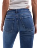Bershka Petite high rise flared jeans in light wash blue