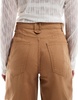 ASOS DESIGN barrel leg jeans in tan with gold details