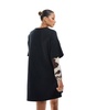 ASOS DESIGN 2 in 1 T-shirt mini dress with cow print sleeves