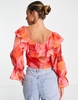 ASOS DESIGN ruffle front blouse with tie in blurred rose print