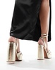 ASOS DESIGN Nikita knotted platform heeled sandals in gold