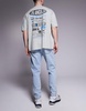 ASOS DESIGN tapered fit jeans in light wash blue