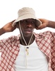 ASOS DESIGN bucket hat with frayed edge in stone