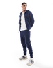 Nike Tech Fleece cuffed sweatpants in navy