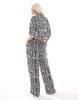 ASOS DESIGN straight leg pull on pants in black and white print - part of a set