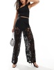 ASOS DESIGN wide leg pants with lace detail in black