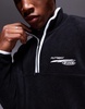 ASOS DESIGN boxy oversized fleece quarter zip sweatshirt with contrast binding and print in black