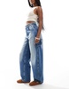 Bershka adjustable waist carpenter jeans in mid wash blue