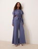 ASOS DESIGN exaggerated ruffle sleeve jumpsuit with cut out waist in blue