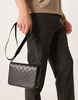 ASOS DESIGN crossbody bag with monogram emboss detail in black faux leather