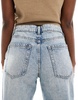 Bershka baggy balloon leg jeans in dirty wash indigo