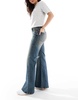 Bershka flared jeans in dirty wash blue