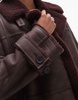 Topshop faux leather shearling long aviator jacket in burgundy