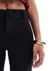 Bershka Petite flared tailored pants in black