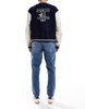 ASOS DESIGN tapered jeans in tinted dark wash blue