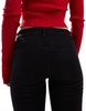 Bershka Petite high waisted flared jeans in black