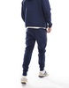 Nike Tech Fleece cuffed sweatpants in navy