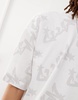 COLLUSION Unisex all-over print T-shirt in white