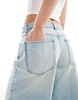 ASOS DESIGN baggy longline denim jorts in bleach wash