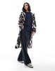 ASOS DESIGN shower proof rain jacket in black and white abstract