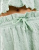ASOS DESIGN textured flippy shorts in sage - part of a set