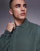ASOS DESIGN boxy overshirt with pockets in khaki