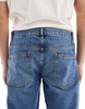 ASOS DESIGN tapered jeans in tinted dark wash blue