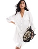Accessorize oversized beach shirt in white
