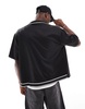 Bershka sports tipped collar shirt in black