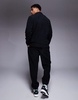 ASOS DESIGN tapered fleece sweatpants in black