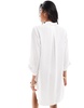 Accessorize oversized beach shirt in white