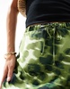ASOS DESIGN satin bias tie waist maxi skirt in green animal print